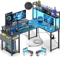 Besiost Small L Shaped Desk Gaming Desk with Power Outlets, 48' Reversible L Shaped Computer Desk with Monitor Stand & Storage Shelf, Corner Gamer Desk Home Office Desk with Storage Bag, Black