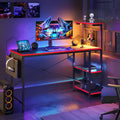 Bestier Gaming Desk with LED Lights, 51.3 Inch Computer Desk with 4 Tiers Reversible Shelves, Gamer Desk with Side Storage Bag, Hooks and Height Adjustable Shelf (Black Carbon Fiber)