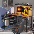 Bestier Gaming Desk 51' L-Shaped, with Power Outlets & LED Lights- 4 Tier Shelves, Reversible Gamer Table with Hooks & Cup Holder for Home Office Black Marble